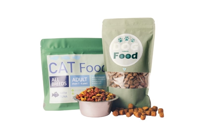 Pet food packages in green bags.