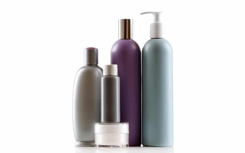 A number of colored personal-care product bottles.