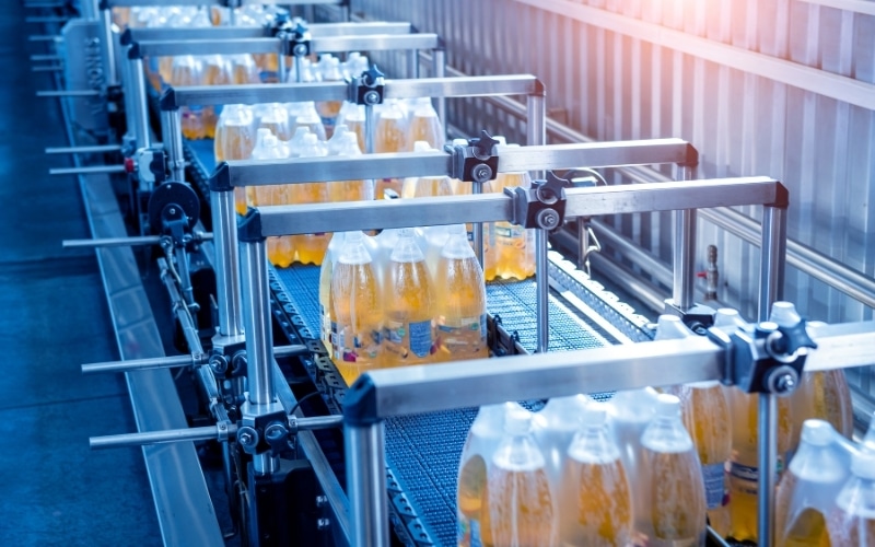 Canned drinks packaged at a manufacturing facility.