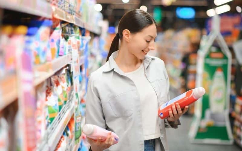 A woman shops for cleaning products
