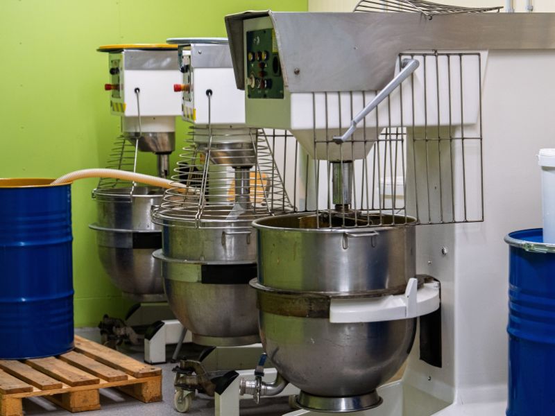 Industrial sized mixers in a packaging facility.