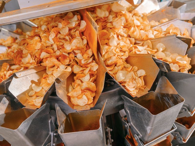 Chips are filled into packages at a food grade packaging facility.